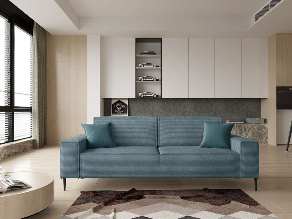 Einzelsofa Cord blau Frontansicht- schwarze abgerundete Füßen- modern minimalistisch in einem hellen Raum
